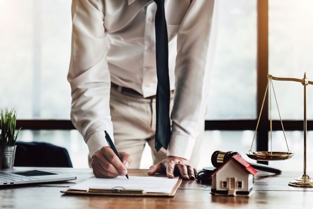 Couple signing real estate contract in a Sacramento, California office