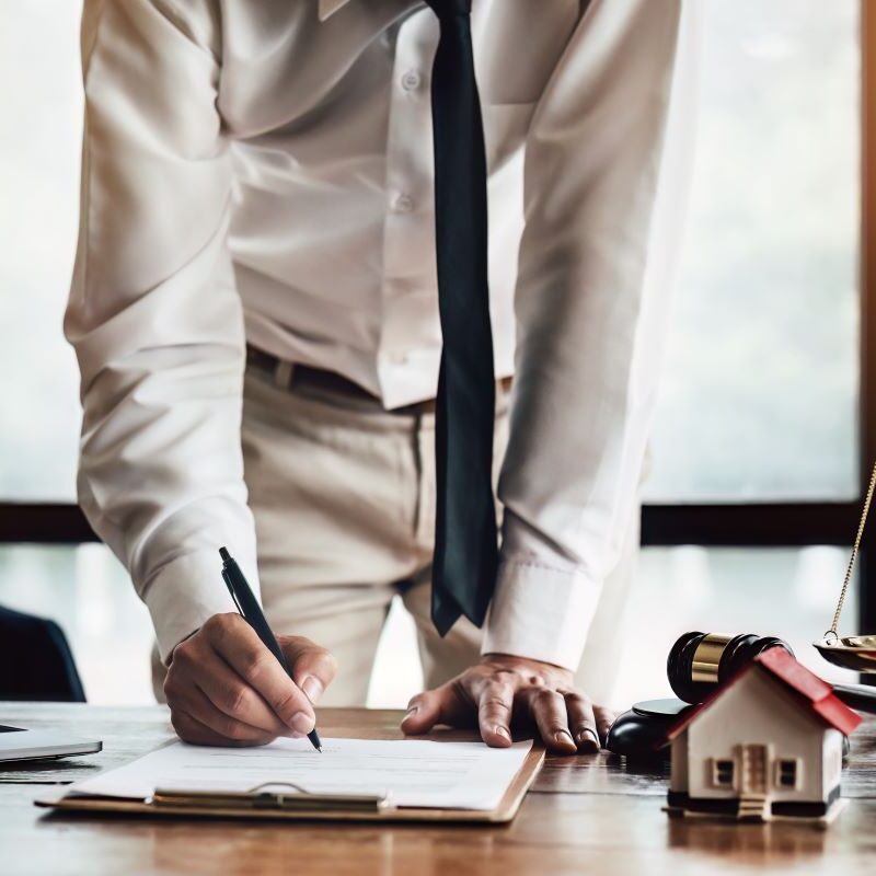 Couple signing real estate contract in a Sacramento, California office